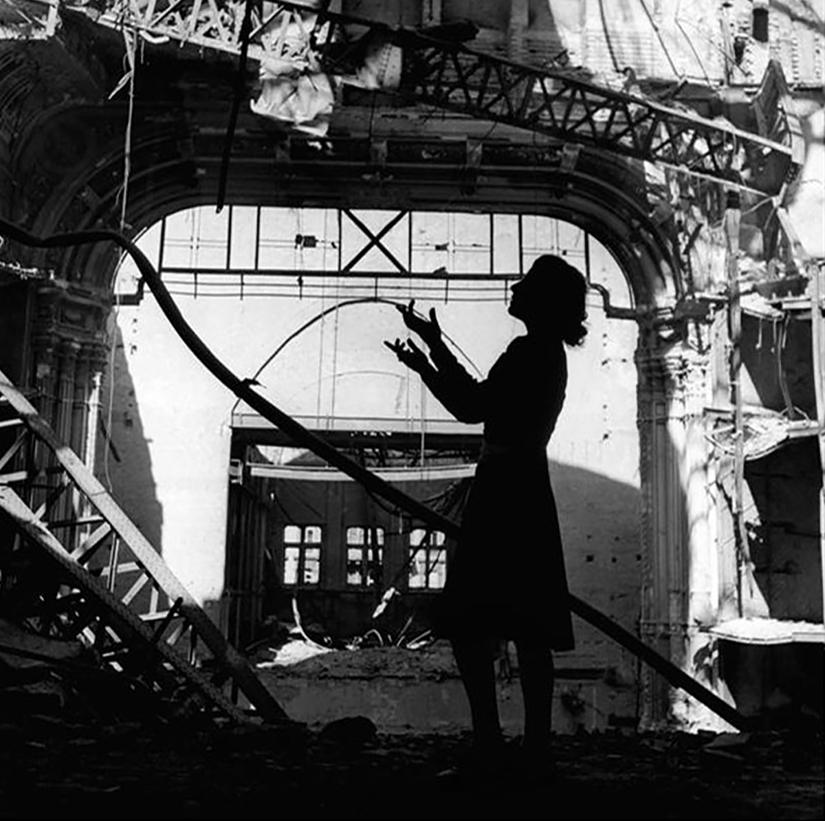 opera singer Irmgard Seefried singing an aria from Puccini's Madame Butterfly amidst the ruins. Taken in 1945